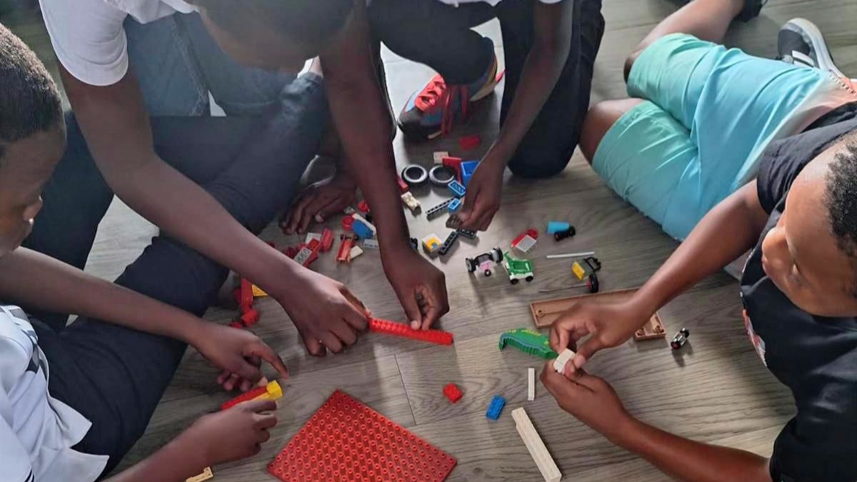 Children building with Lego