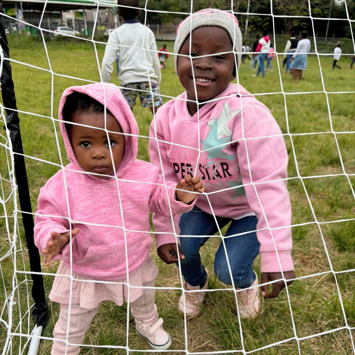 Happy children at soccer goal