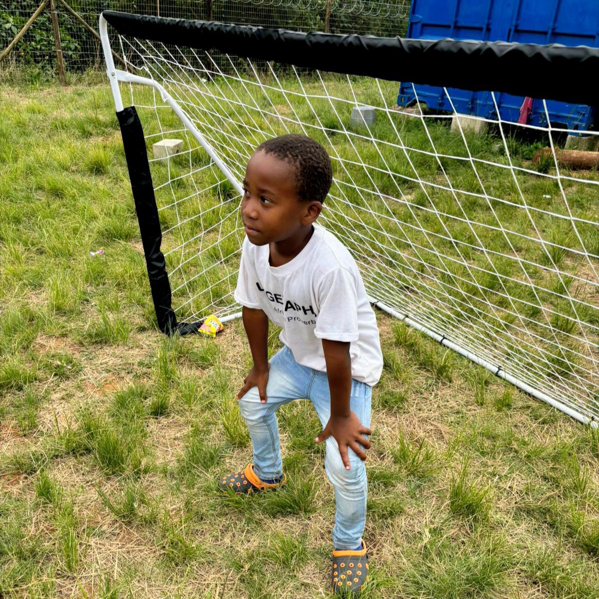 Young boy by the soccer goal